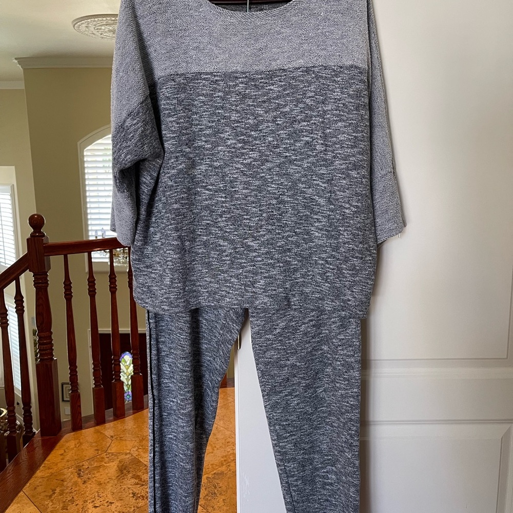 Nicely embellished 2 Pc. track suit with tapered pants. GUC